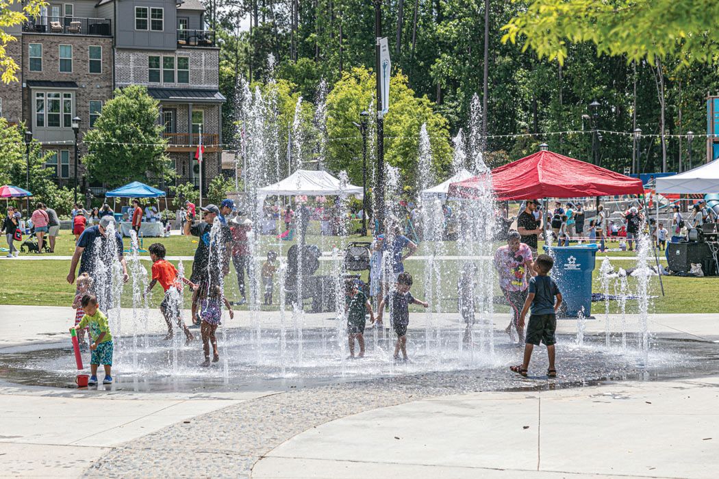 https://livinginpeachtreecorners.com/wp-content/uploads/2022/08/tracey-rice-splashpad.jpeg