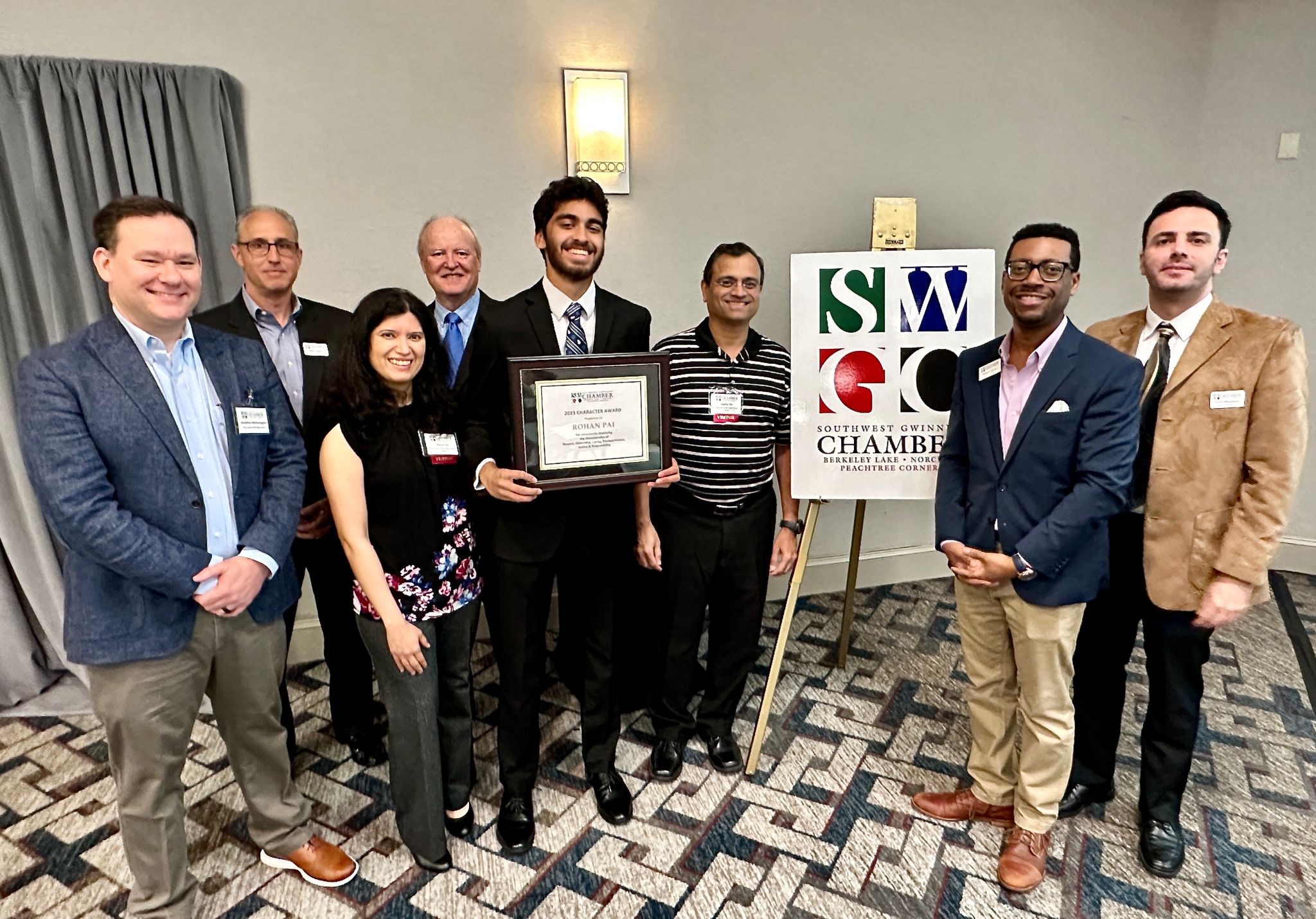 L to R: Principal Jonathon Wetherington, Mark Klafter, Manasi Pai, Scott Lee, Rohan Pai, Jagdish Pai, William Corbin and Frank Meyghani.