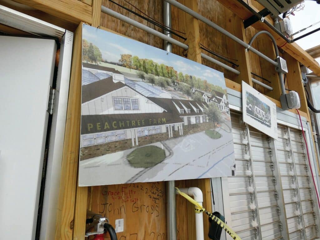 Peachtree Farm's ultimate vision board posted on the walls of their greenhouse