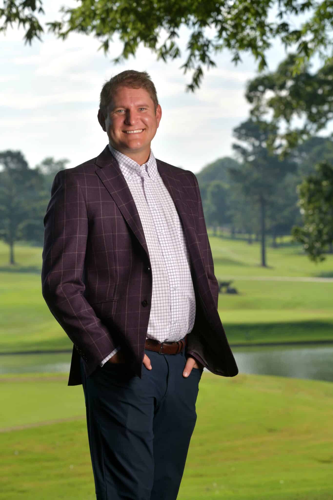 Alex Urban standing on a golf course