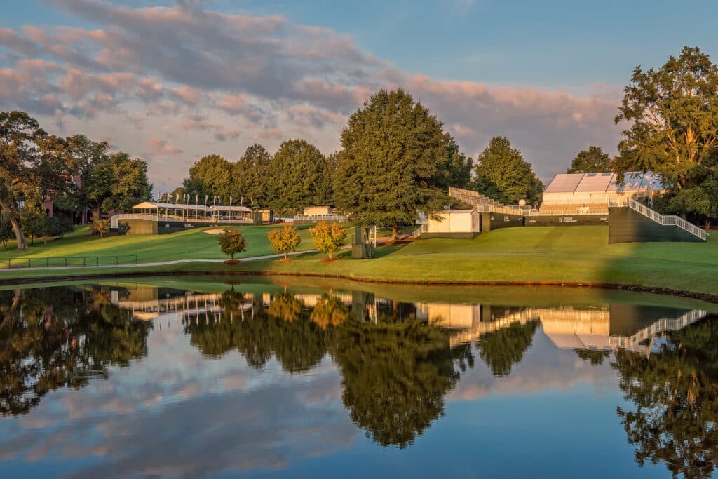 Water, greens and stands at East Lake Golf Club