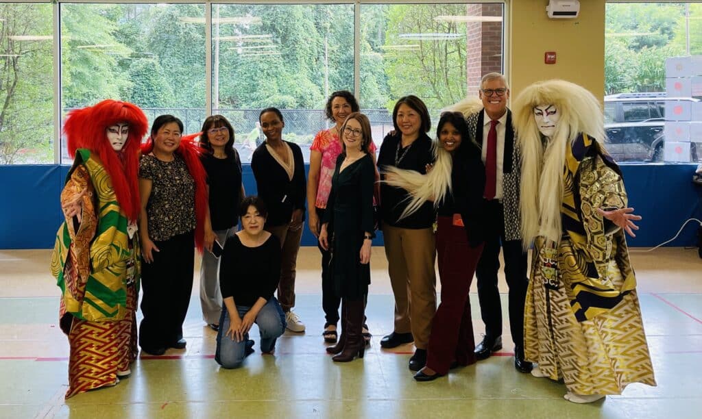 School faculty and board members with performers from Miyabiya Japan Kabuki troop