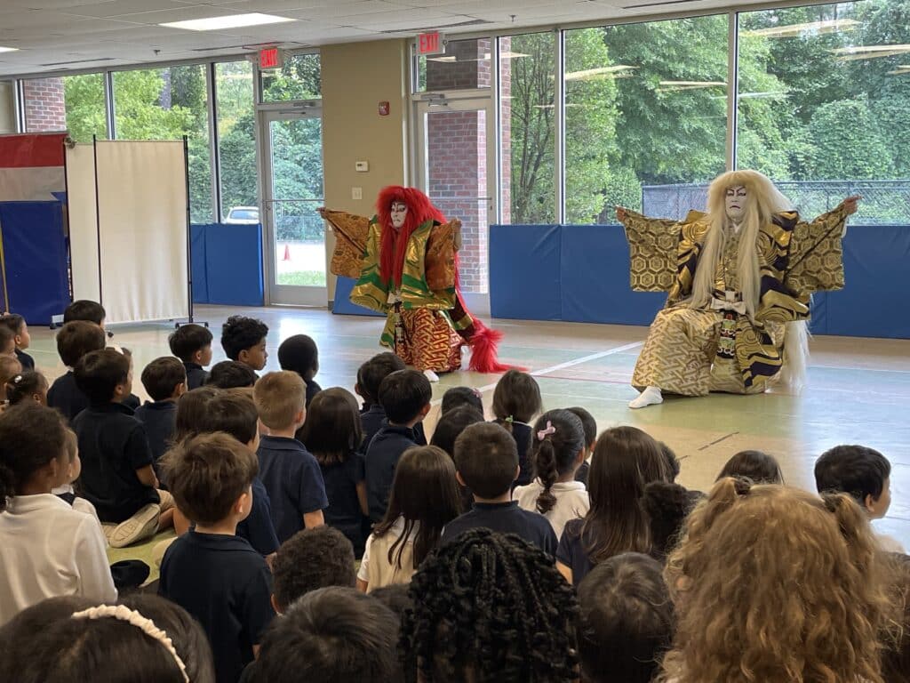 Kabuki performers in front of a K-6 audience