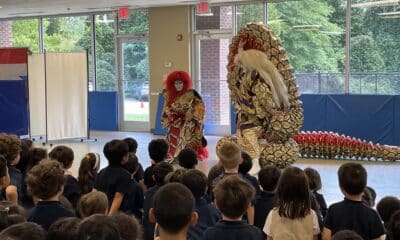 kabuki performers in front of an audience of K-6 students