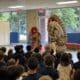 kabuki performers in front of an audience of K-6 students