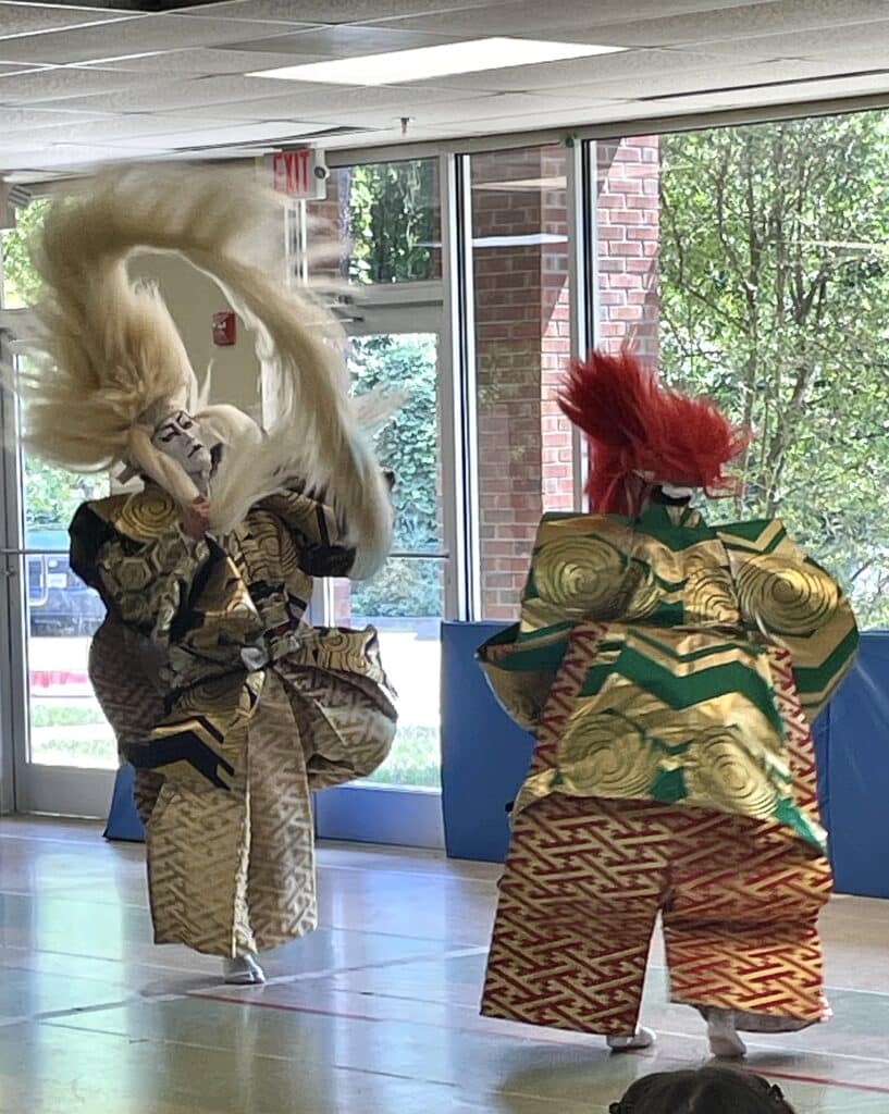 Kabuki dancers in motion during performance