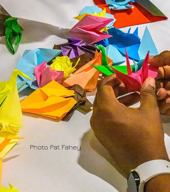 hands folding origami