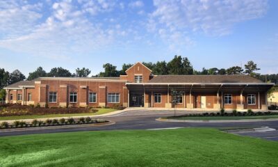 a school building and green lawn