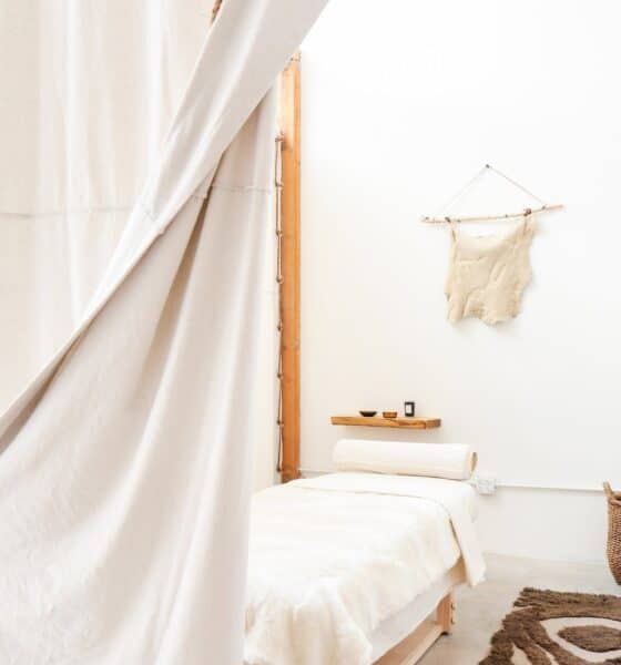 massage room with soft lighting and natural materials