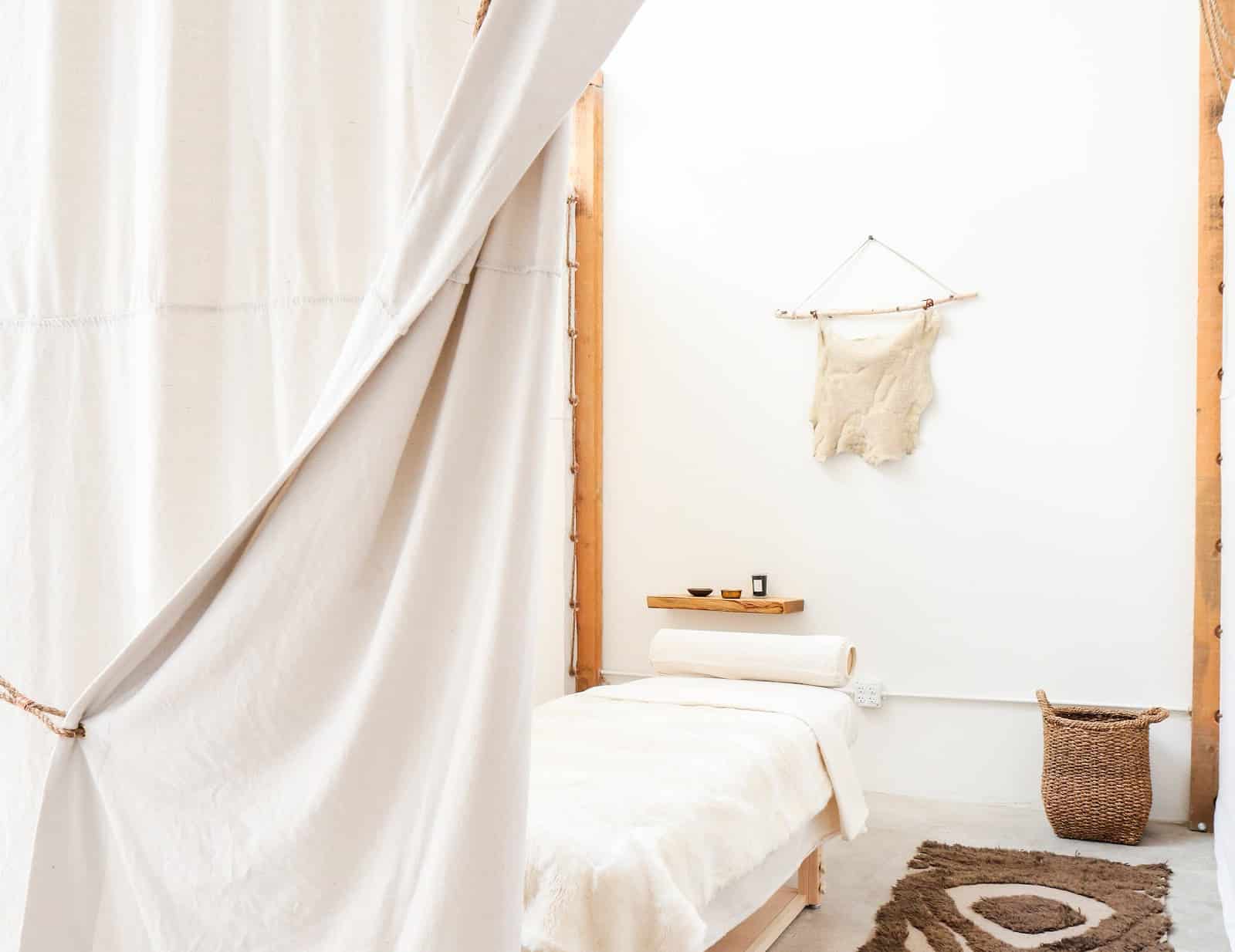 massage room with soft lighting and natural materials