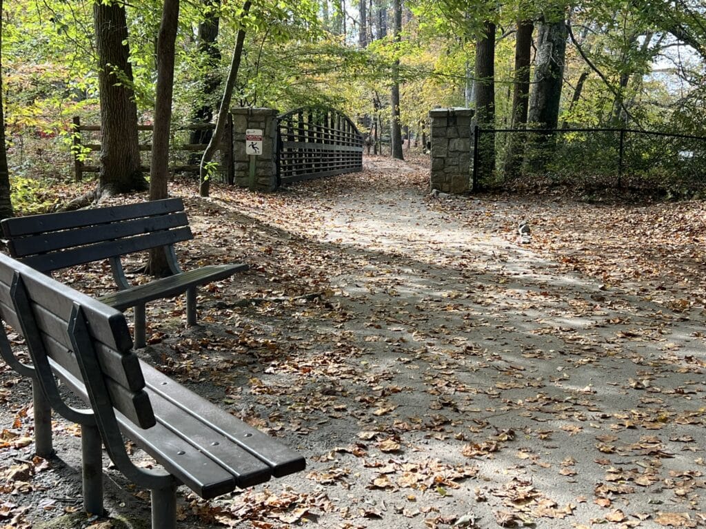 Benches on an empty walkway at Jones Bridge Park on a fall day