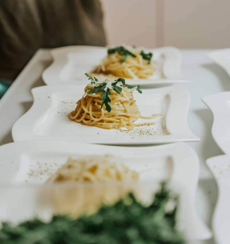 three plates of cacio e pepe