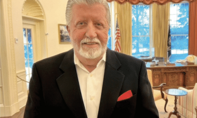 Man standing in replica of the oval office at The Carter Center