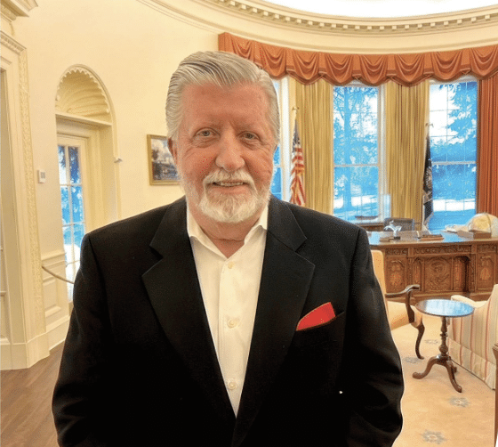 Man standing in replica of the oval office at The Carter Center