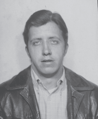 Young man in a button-up shirt and leather jacket in the 1970s