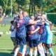 US Soccer team at the Transplant Football World Cup celebrating on the field