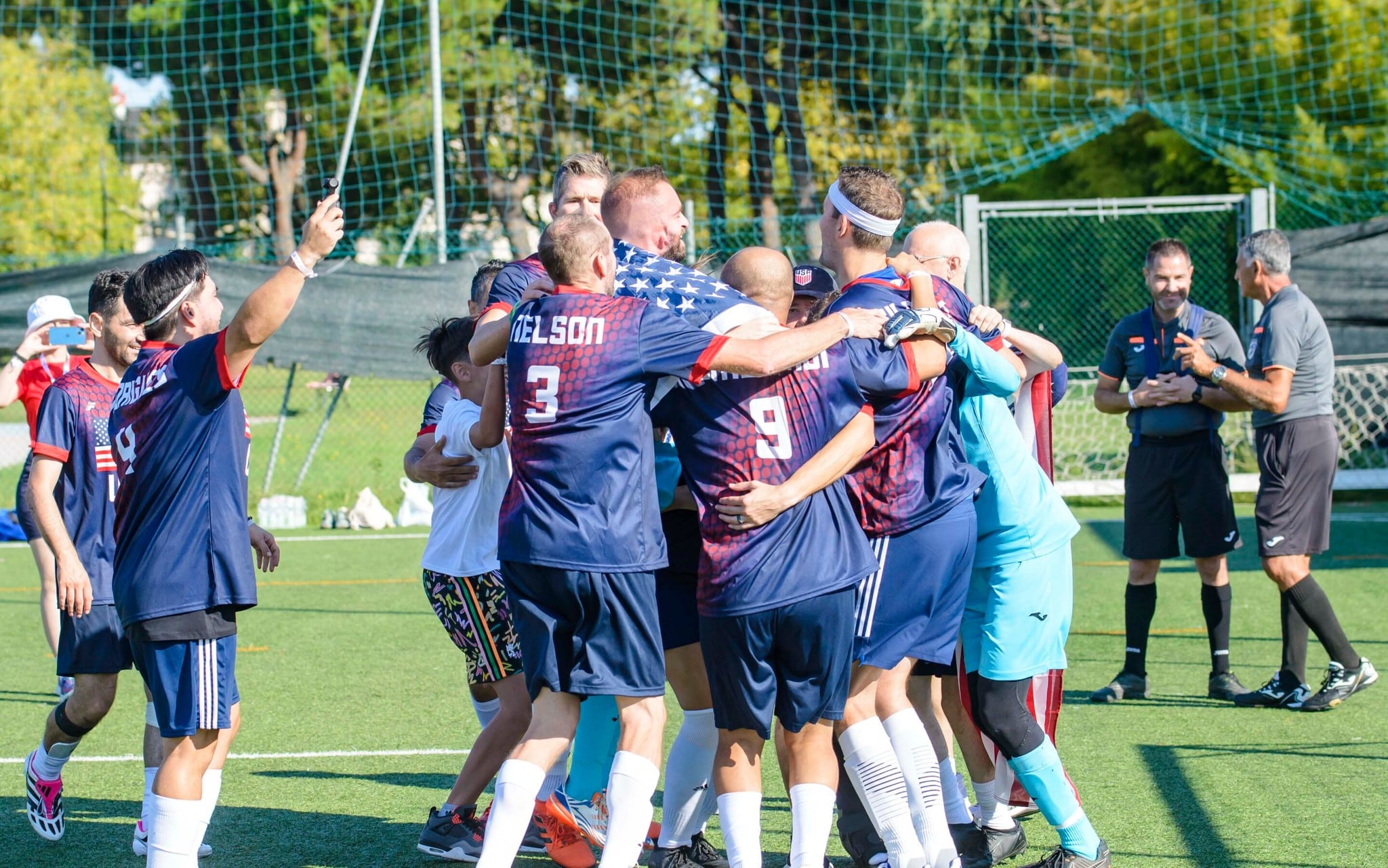 US Soccer team at the Transplant Football World Cup celebrating on the field