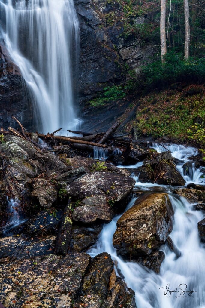 Waterfall, rocks, trees and small stream at Anna Ruby Falls