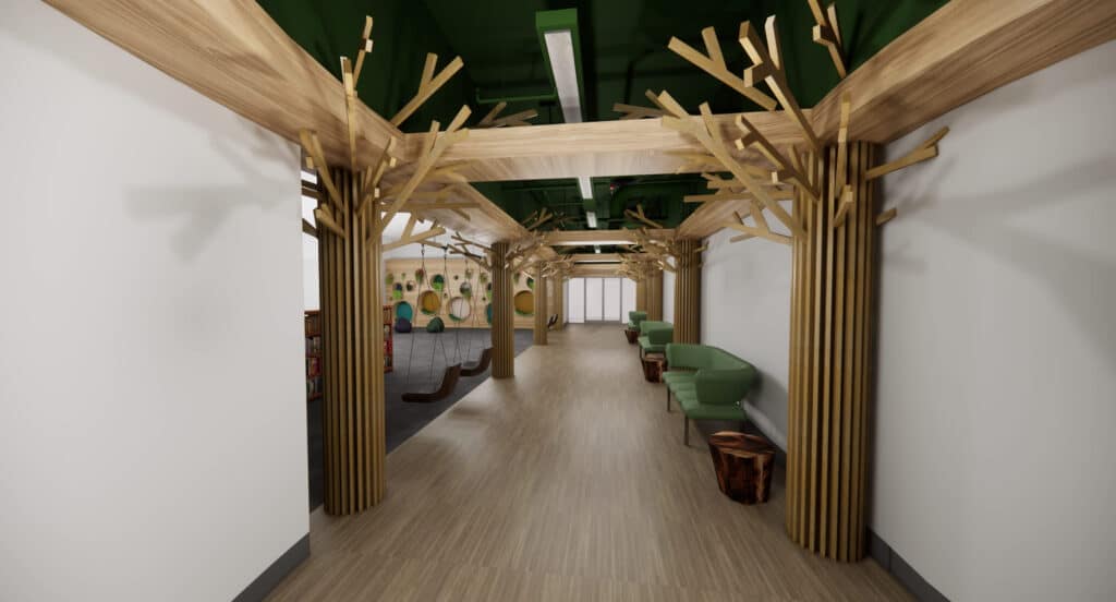 Rendered image of a hallway in an elementary school. White walls with natural brown wood beams and tree shaped pillars lead to an open hangout space with comfortable seating.