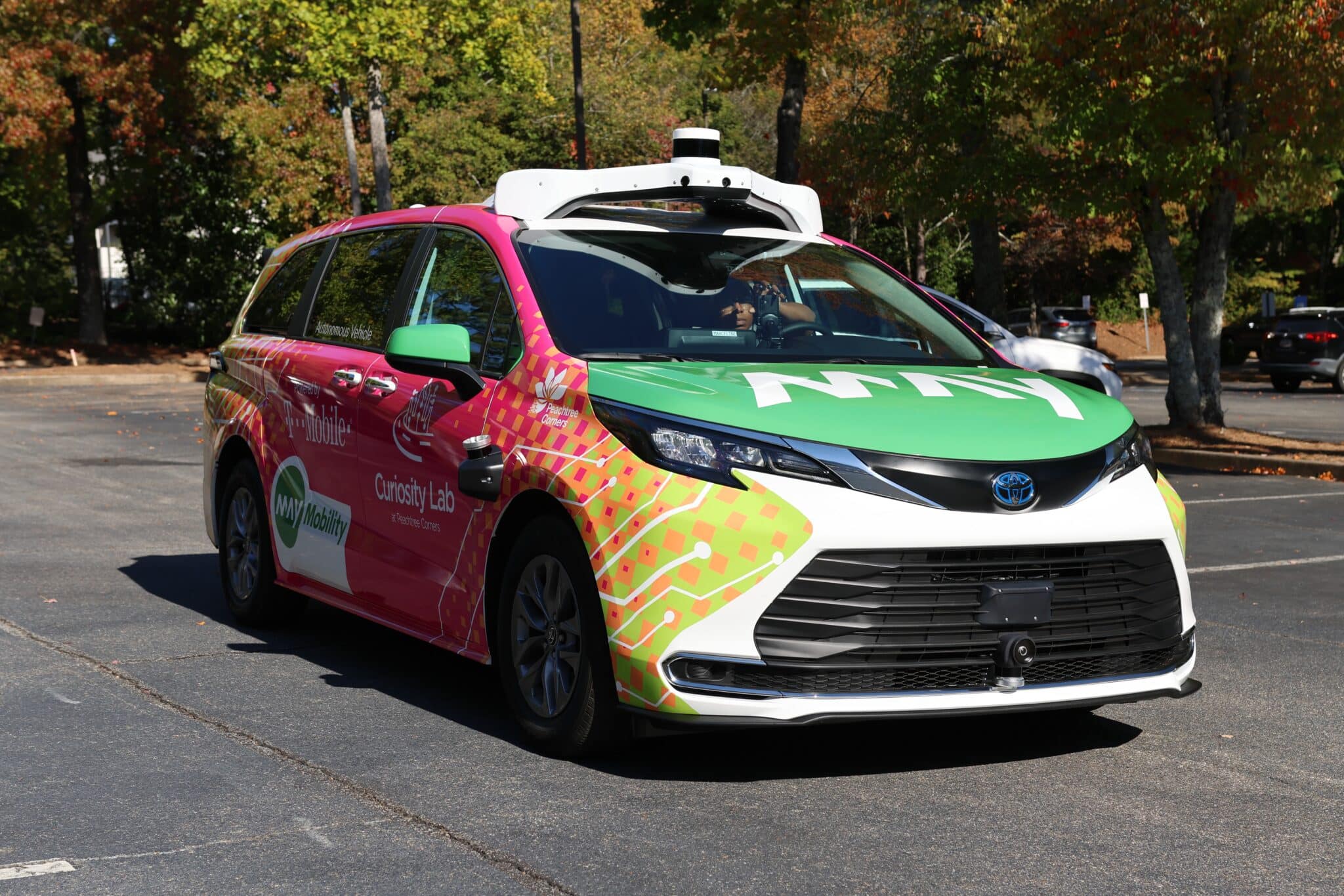 self-driving, multi-colored vehicle from May Mobility in service in Peachtree Corners, GA