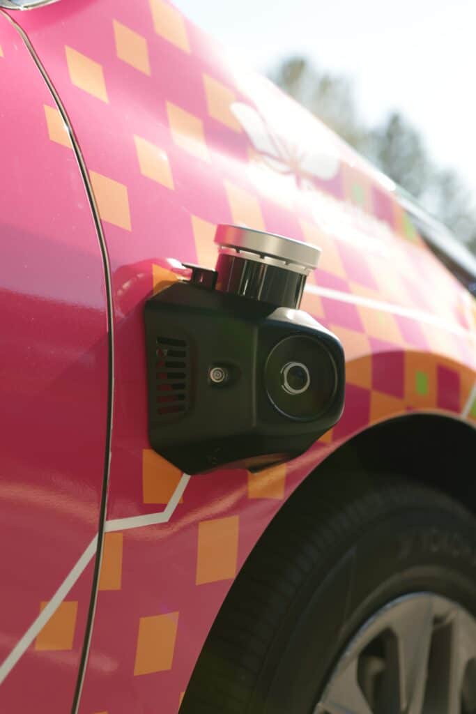 Up-close look at a sensor on the multi-colored, self-driving car from May Mobility on the road in Peachtree Corners