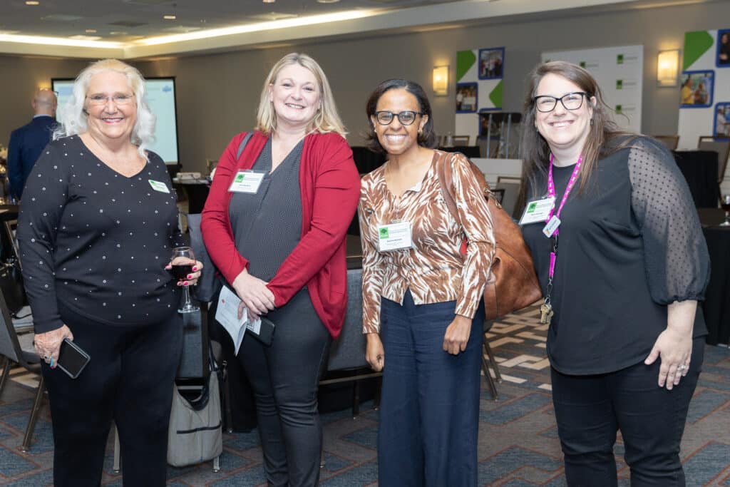 Four women at a business panel event