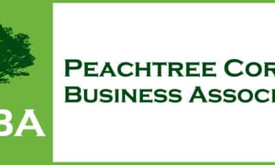 Peachtree Corners Business Association log with dark green tree on a light green background and PCBA in white type.