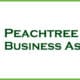 Peachtree Corners Business Association log with dark green tree on a light green background and PCBA in white type.