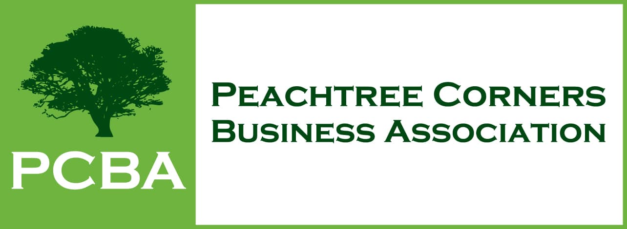 Peachtree Corners Business Association log with dark green tree on a light green background and PCBA in white type.