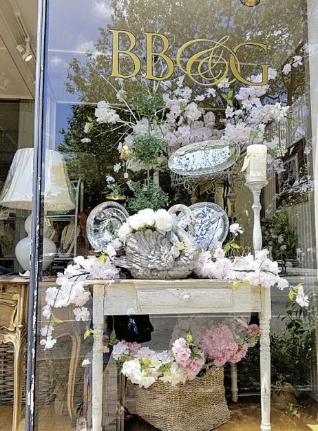 Store front window at a quaint shop in Madison, GA.