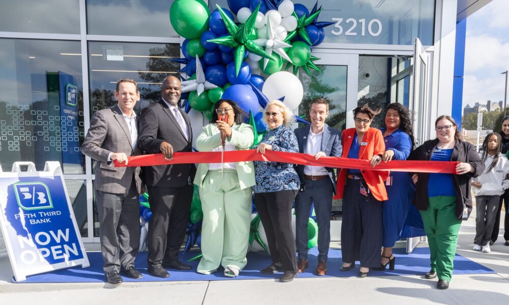 Group of people in front of a Fifth Third Bank location for a ribbon cutting