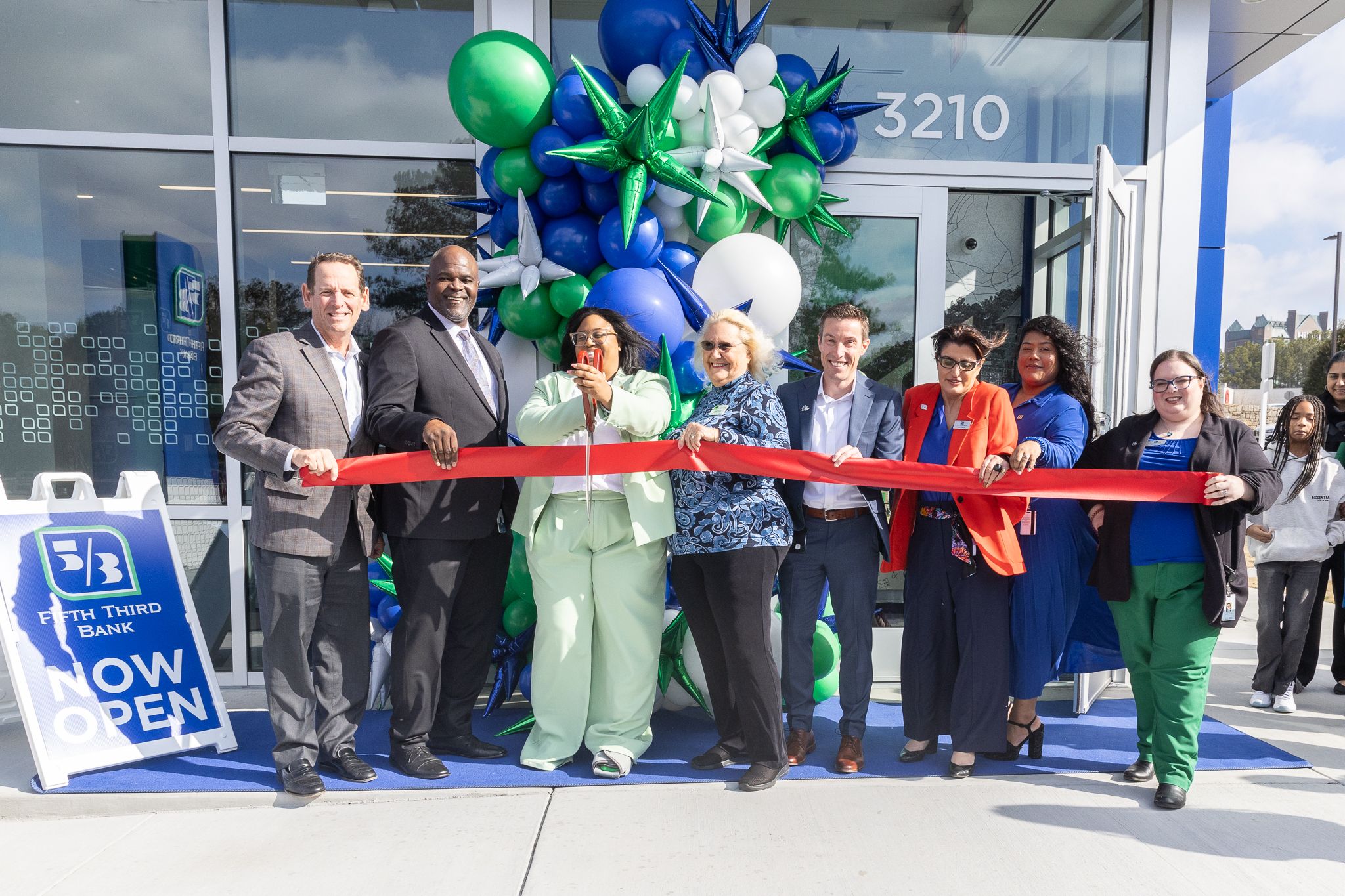 Group of people in front of a Fifth Third Bank location for a ribbon cutting