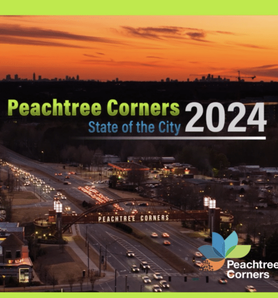 Aerial view of Peachtree Corners at night as the sun sets. Peachtree Corners State of the City 2024 in green, blue and white text is laid over the image and the PTC logo is in the bottom right corner.