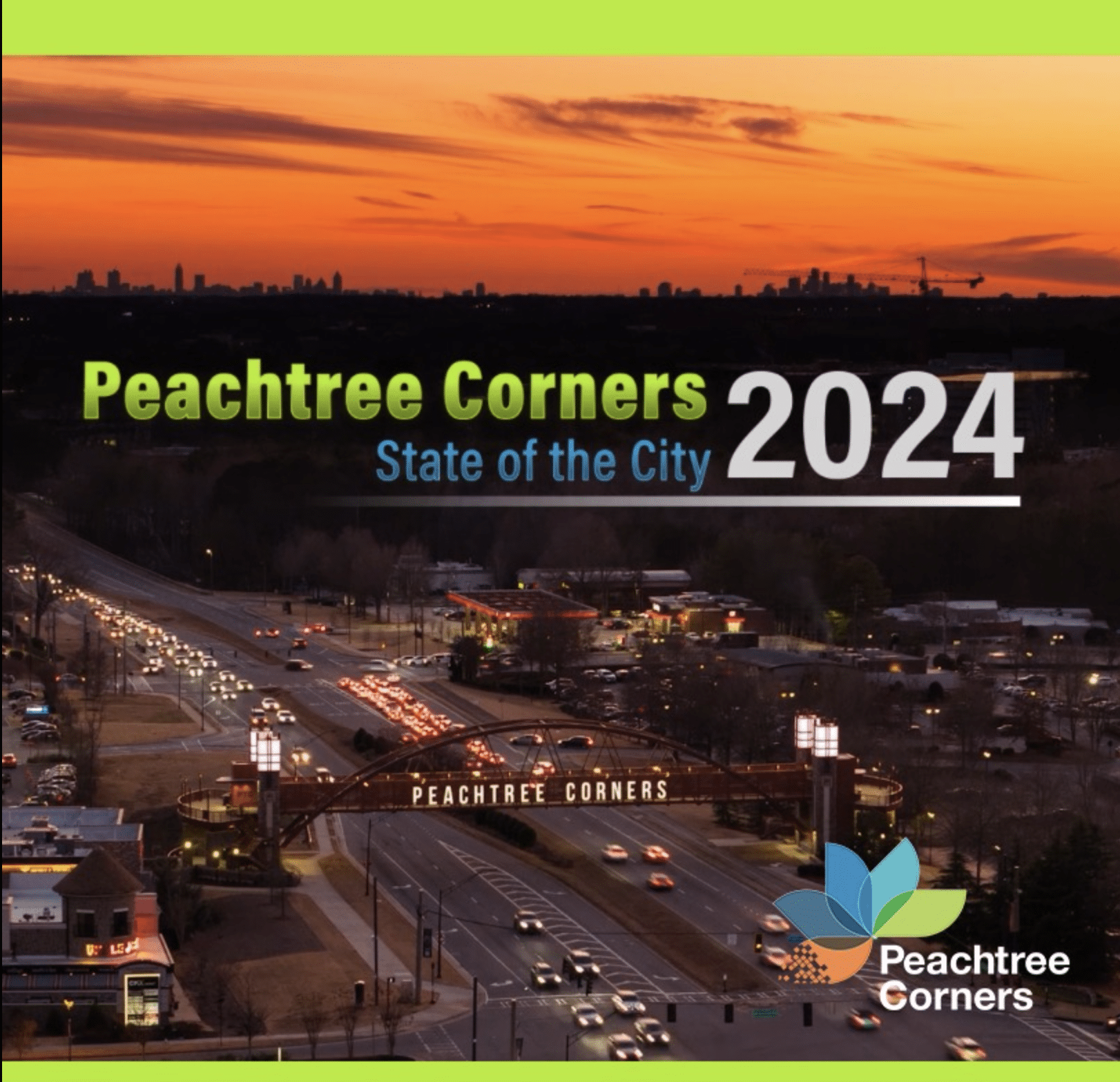 Aerial view of Peachtree Corners at night as the sun sets. Peachtree Corners State of the City 2024 in green, blue and white text is laid over the image and the PTC logo is in the bottom right corner.