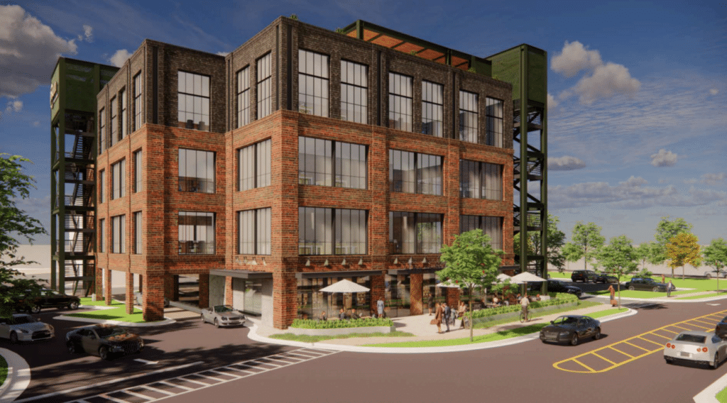 Rendering of the exterior of a three-story brick and glass building with green space area and outdoor cafe tables.