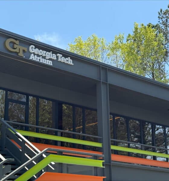 Exterior of the GT Atrium in Peachtree Corners building, with stars, logo and front entrance