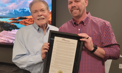 Mayor Mike Mason of Peachtree Corners presenting a proclamation for service to Assistant City Manager Brandon Branham