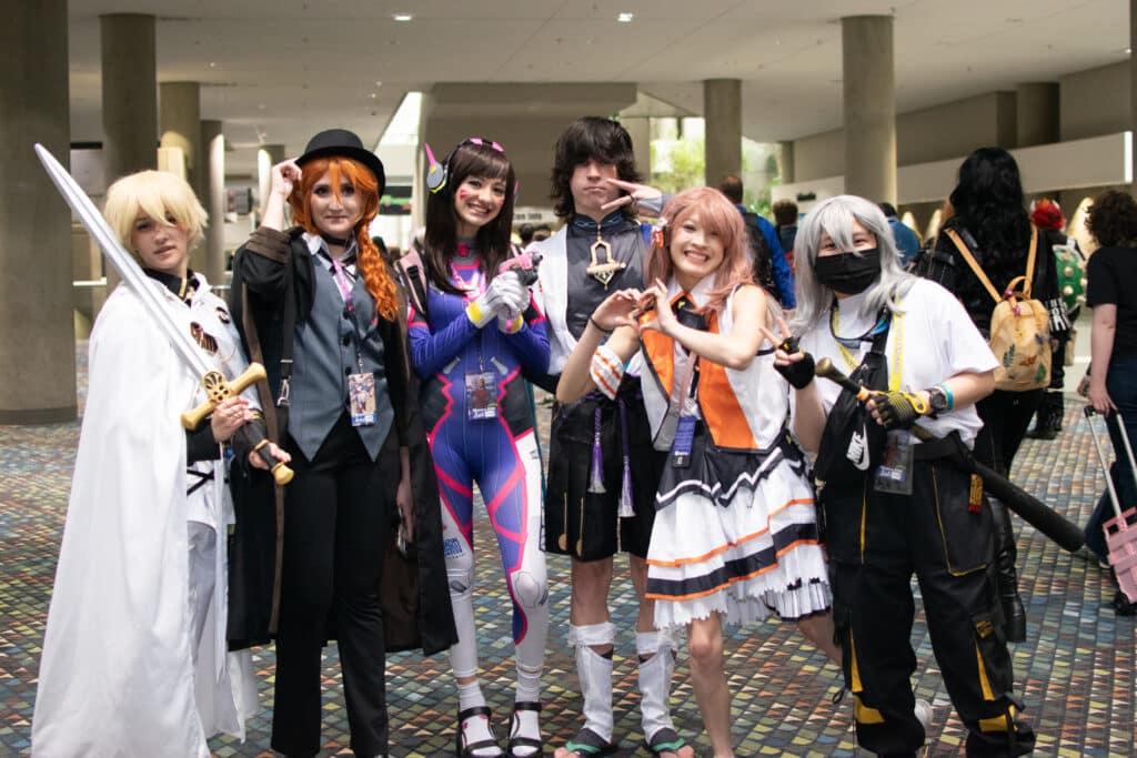 A group of cosplayers in elaborate costumes at MomoCon 2024