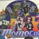 MomoCon 2025 entrance with colorful anime-style illustration and logo