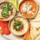 A trio of dips and pita bread from Sheesh Mediterranean